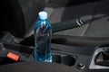 In the car in the cup holder there is a bottle of water, for the driver Royalty Free Stock Photo