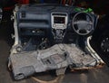 Car cut into half in a mechanic workshop