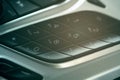 Car dashboard dial pad beside audio control buttons Royalty Free Stock Photo