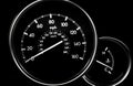 Car dashboard dials - speedometer and engine temperature gauge Royalty Free Stock Photo