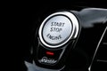 Car dashboard with focus on engine start stop button. Modern car interior details. start/stop button. Car inside. Ignition remote Royalty Free Stock Photo