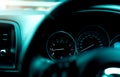 Car dashboard interior view. Car instrument panel with tachometer and speedometer. View from steering wheel to rpm gauge and speed Royalty Free Stock Photo