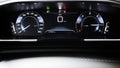 Car dashboard panel with speedometer, tachometer, odometer, fuel gauge and gear position indicator.