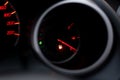 The car dashboard shows the flue gas with red. The oil warning light is running out.Close up image of illuminated car dashboard Royalty Free Stock Photo