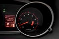 Car dashboard with speedometer and illuminated fuel consumption indicator close up. Modern electronics inside vehicle Royalty Free Stock Photo