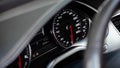 Car dashboard with white backlight: Odometer, speedometer, tachometer, fuel level, water temperature and more. Royalty Free Stock Photo