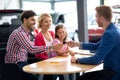 Car dealer selling new car to young family Royalty Free Stock Photo