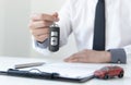 Car dealers or insurance managers cover and protect against damage and the risk of driving, Hold the car keys