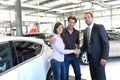 Car dealership advice - sellers and customers when buying a car Royalty Free Stock Photo