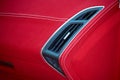 Car deflector. Car interior details. Red and black alcantara with stitching Royalty Free Stock Photo