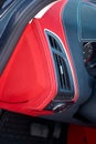 Car deflector. Car interior details. Red and black alcantara with stitching Royalty Free Stock Photo