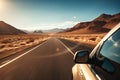 Car on desert highway road. Car trip along desert mountain landscape, closeup side view Royalty Free Stock Photo