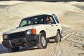 Car, desert and people driving for travel and transportation outdoor, off road vehicle for sand dunes and journey on Royalty Free Stock Photo