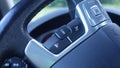 Car detail, cruise control switch, tempomat, speed limitation button, modern car, Royalty Free Stock Photo