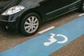 Disabled parking spaces with white pictogram