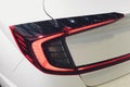 Car detail. New led taillight by night. The rear lights of the car, in hybrid sports car. Developed Car`s rear brake Royalty Free Stock Photo