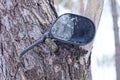 car detail from an old black metal rear view mirror with white frozen ice and snow Royalty Free Stock Photo