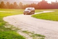 Car on dirt road curve and green grass park Royalty Free Stock Photo