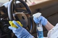 Car disinfecting service. Cleansing car interior and spraying with disinfection liquid