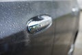 Car door handle with drops the rain Royalty Free Stock Photo