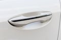 Car door handle of modern white car, close up Royalty Free Stock Photo