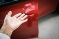 Car door handle red color for customers. Using wallpaper or background for transport and automotive image. Royalty Free Stock Photo