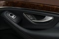 Car door handle with windows control buttons. Royalty Free Stock Photo