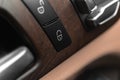 Car door lock switch close-up. Car lock buttons in modern luxury vehicle with leather interior, background photo Royalty Free Stock Photo