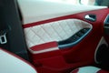 Car Doors. Car interior details. White red leather with stitching Royalty Free Stock Photo