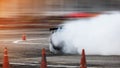 Car drifting, Blurred of image diffusion race drift car with lots of smoke from burning tires on speed track Royalty Free Stock Photo