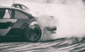 Car drifting, Sport car wheel drifting and smoking on blurred background. Motorsport concept