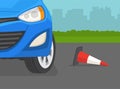 Car drive practicing. Blue suv car downed red traffic cone. Close-up front view of a red cone and front tire. Royalty Free Stock Photo