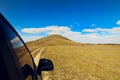 A car drive to the Hill under the blue sky