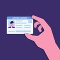 Car driver license in hand.Holding the id card. Royalty Free Stock Photo