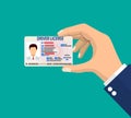 Car driver license identification card in hand Royalty Free Stock Photo