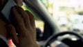 Car driver talking on cellphone with client, sitting in auto, callback, busy day Royalty Free Stock Photo