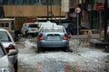 A car drives carefully through the built-up rain water in the streets of Riyadh, Saudi Arabia