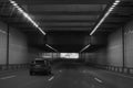 Car drives through the tunnel black and white Royalty Free Stock Photo