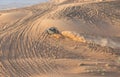 Car driving in a desert