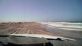 Car driving at dirt road in desert. Sand drive at the beach. Coast of sea. Royalty Free Stock Photo