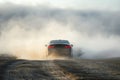 Car Driving Down a Dirt Road in the Mountains Royalty Free Stock Photo