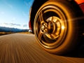 A car is driving down a road with a wheel spinning Royalty Free Stock Photo