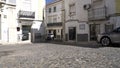 Car driving down small road, Estremoz, Alentejo Portugal