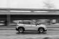 The car is driving down the street in the rain. Citroen C3 Aircross. Motion blur. Riga, Latvia - 18 Dec 2021 Royalty Free Stock Photo