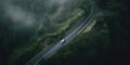 A car driving down a winding road in the middle of a forest. AI generative image. Royalty Free Stock Photo