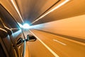 Car driving fast exit the tunnel Royalty Free Stock Photo