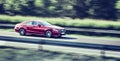 Car driving fast on highway motion blur Royalty Free Stock Photo