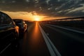 Car driving fast on the highway road against sky with sunset Royalty Free Stock Photo