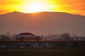 Car driving fast on intercity road at sunset. Highway traffic in evening