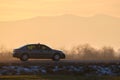 Car driving fast on intercity road at sunset. Highway traffic in evening Royalty Free Stock Photo